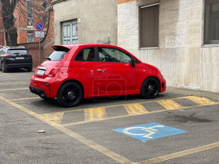 Photo for Cremona, Italy - April 2023 red Fiat 595 Abarth sport compact city car parked in the street - Royalty Free Image