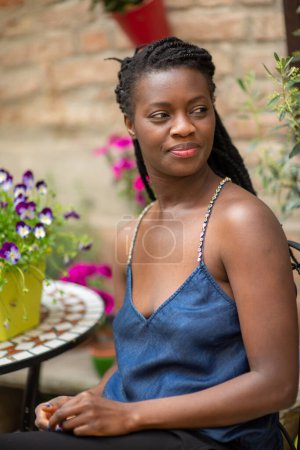 Photo for Happy young black woman smile. Stylish model. Braid dreadlock hairstyle. Joyful smiley African female in selective focus outdoors, fashion style, happiness concept. Outdoors. - Royalty Free Image