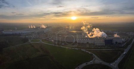 Photo for Cremona, Italy - January 2022 Drone aerial view of Arvedi working steel plant at dawn, industrial zone in Spinadesco, Cremona, Lombardy Italy - Royalty Free Image
