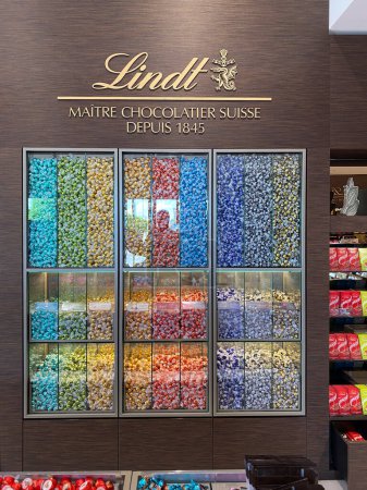 Photo for Fidenza, Italy - May 2023 Inside Lindt castle chocolate shop and bar store in luxury fashion shopping outlet mall in Fidenza, Italy - Royalty Free Image