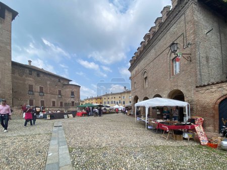 Photo for Fontanellato, Italy - May 2023 Antique market in the center of the city surrounding San Vitali medieval castle in Parma province, Italy. - Royalty Free Image