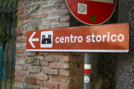 Photo for One way italian traffic street sign to historical center with arrow and castle icon, centro storico text - Royalty Free Image