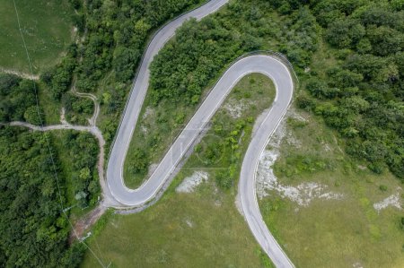 Photo for Topdown drone cinematic view of road turns on a mountain road - Royalty Free Image