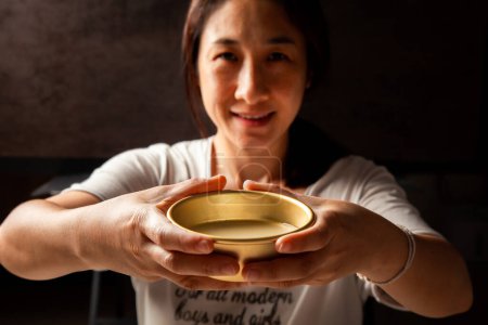Photo for Asian women enjoying drinking makgeolli to celebrate. Makgeolli rice wine is a Korean fermented alcoholic beverage traditional drinks. - Royalty Free Image