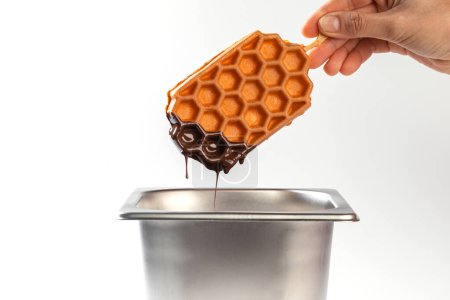 Photo for Waffles chocolate dip on a white table. Fresh waffles breakfast, snack on white background - Royalty Free Image