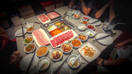 Photo for Chinese Hotpot Ma la. Mala Hot Pot or Szechuan Spicy Hot Pot consist of a spicy broth in which you put raw meat and vegetables to cook them before eating. - Royalty Free Image