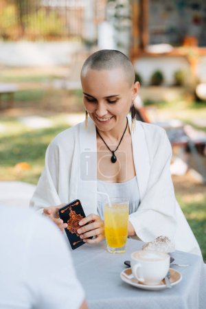 Photo for A bald woman tarot reader has a session with a client. High quality photo - Royalty Free Image