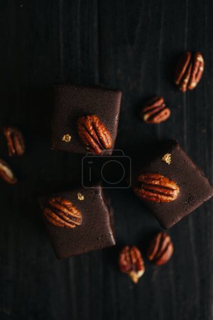 Halva at dark background with nuts. High quality photo