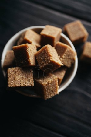 A still life of Halva in a bowl at dark background. High quality photo