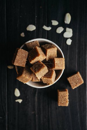 A still life of Halva in a bowl at dark background. High quality photo
