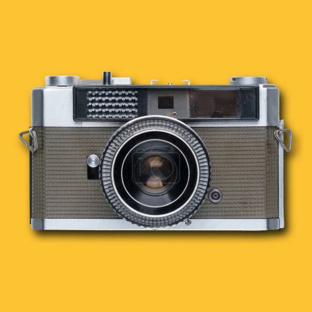 Photo for Vintage old film camera on yellow background with shadow - Royalty Free Image