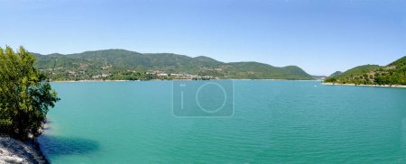 Photo for Overview of Lake Turano and in the background the village of Castel di Tora, in the province of Rieti in Lazio, Italy - Royalty Free Image