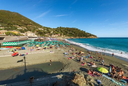 Photo for BONASSOLA, ITALY - JULY, 2023: Bonassola beach crowded with tourists on a sunny summer day, small town and tourist resort in Ligurian coast. La Spezia province, Liguria, Italy, Europe. - Royalty Free Image