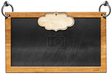 Photo for Old empty blackboard with wooden rectangular frame and blank label. Steel rings for hanging. Isolated on white background and copy space, template. - Royalty Free Image