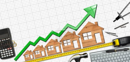 Photo for Growth graph with five wooden houses and green arrow moving up, on a desk with calculator, tape measure, Euro coins, hammer,  drawing compass, pencil and a computer keyboard. - Royalty Free Image