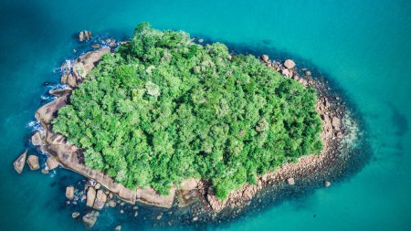 Photo for Small island with forest on top, rocks and turquoise sea water, view from top to bottom, drone landscape, drone view, tropical, summer - Ilha do Maracuja - Ubatuba - Sao Paulo - Brazil - Royalty Free Image