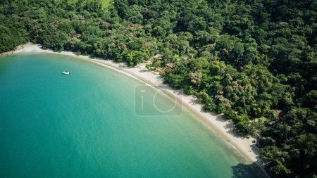 Photo for Beach landscape on a sunny day, seen from above, drone photography, calm turquoise waters, with a small island in the foreground, mountains with forest, Praia da Justa, Ubatuba - Sao Paulo - Brasil - Royalty Free Image