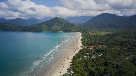 Photo for Beach landscape on a sunny day, seen from above, drone photography, calm turquoise waters, mountains with forest, tropical, river, nature, travel, Praia do Ubatumirim - Ubatuba - Sao Paulo - Brazil - Royalty Free Image