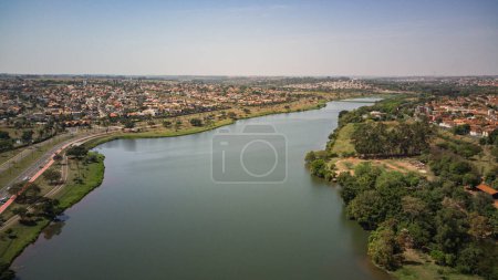 Photo for Aerial view of the Rio Preto municipal dam in drone panorama, aerial view on a sunny day with the avenues and highways and the park and the river in high resolution - Sao Jose do Rio Preto - Sao Paulo- Brasil - Royalty Free Image