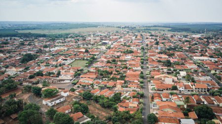 Photo for City of Palestina, located in the interior of Brazil seen from above on a slightly cloudy day, taking the church square as a reference and showing the entire city from a drone's point of view - Royalty Free Image