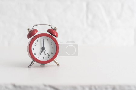 Photo for Red alarm clock set at four isolated over white background close-up - Royalty Free Image
