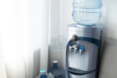 Photo for Blue water gallon on water cooler in office - Royalty Free Image