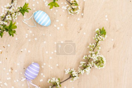Photo for A Easter egg on a branch of a blooming cherry tree. Easter spring background. - Royalty Free Image