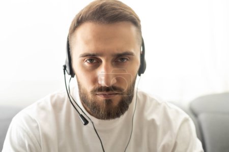 Photo for Close up headshot portrait of smiling man in headphones glasses have webcam conference at home office, profile picture of happy male in earphones speak talk on video call, virtual event concept. - Royalty Free Image