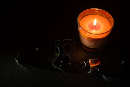 Photo for Composition with the toy handcuffs, candle - Royalty Free Image