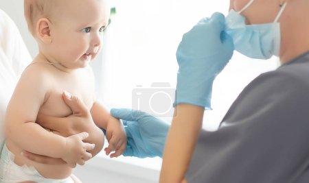 Photo for Pediatrician makes vaccination to small boy. - Royalty Free Image