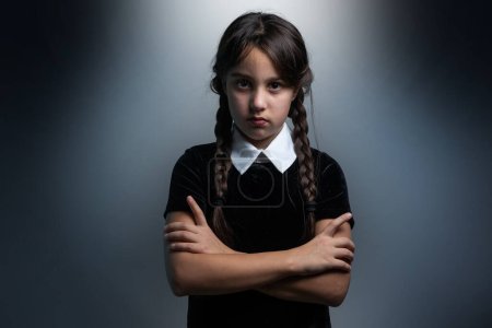 a girl in a Wednesday Addams costume style.