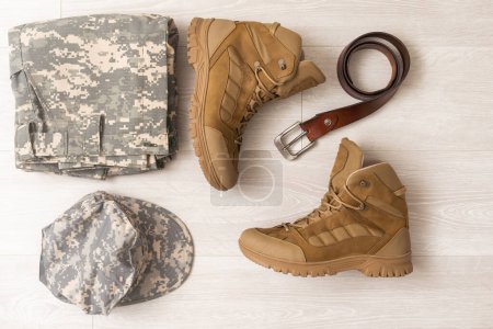 Photo for Military camouflage uniforms and boots. - Royalty Free Image