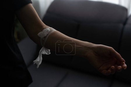 Photo for Hand plaster after donating blood. - Royalty Free Image