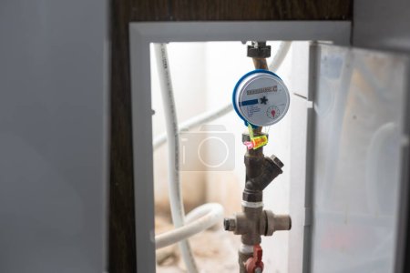 Photo for Water meters installed on the pipe and sealed - Royalty Free Image