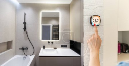 Téléchargez les photos : La température sur le thermostat moderne, programmable Nest Thermostat. - en image libre de droit