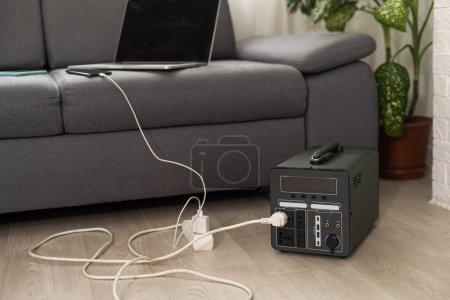 Photo for Charging station. Generator power bank battery in the absence of electricity. Charging for phone, tablet, laptop and other gadgets when there is no light during blackout - Royalty Free Image