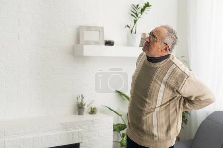 an elderly man has a backache.