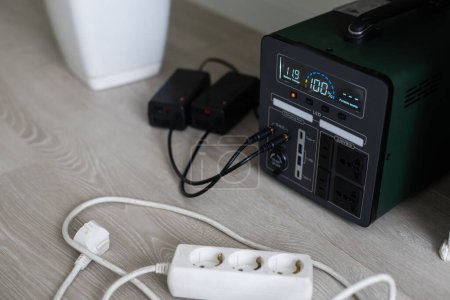 Photo for Charging station for phone, tablet, laptop and other gadgets when there is no light during blackout. Generator power bank battery in the absence of electricity. Charge electric rechargeable battery. - Royalty Free Image