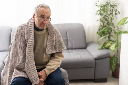 Photo for Close up face of sad caucasian senior 80s man feels upset and lonely standing indoors looking away, concept of solitude, nursing home care, senile diseases Parkinson Alzheimer Dementia ageing process - Royalty Free Image