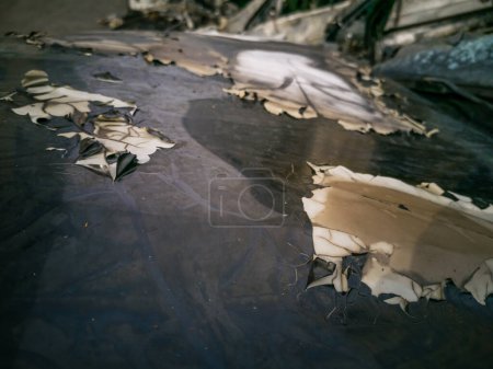 Photo for A cropped front view of a burned and abandoned rusty cars. - Royalty Free Image