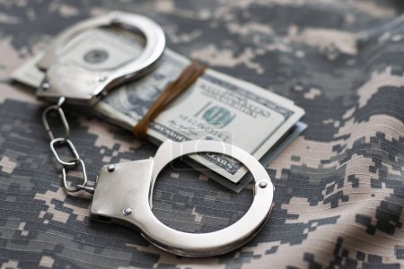 Photo for Military uniform and handcuffs, money - Royalty Free Image