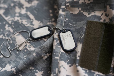 Territorial Defence Forces of Ukraine uniform insignia badge on camouflaged uniform background