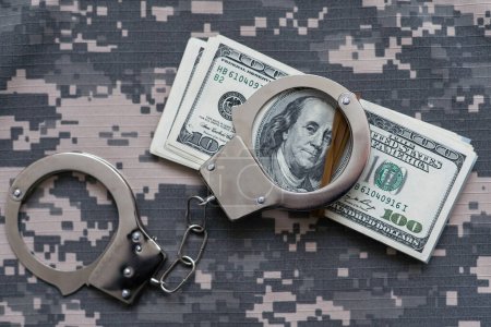Photo for Military uniform and handcuffs, money - Royalty Free Image