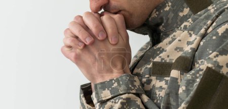 Photo for Closeup Shot Of Clasped Hands Of Unrecognizable Soldier In Camouflage Army Uniform, Military man. - Royalty Free Image