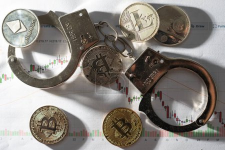 Photo for Symbolic coins of bitcoin and stack of bitcoin coins and metall handcuffs on banknotes of one hundred dollars. Exchange bitcoin for a cash dollar, but be a law-abiding citizen. High quality photo - Royalty Free Image