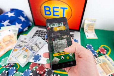 Photo for Man using online sports betting services on phone. High quality photo - Royalty Free Image
