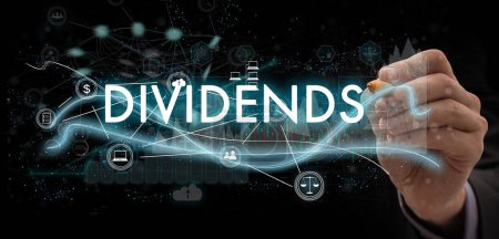 Photo for DIVIDENDS concept presented by businessman touching on virtual screen ,image element furnished by NASA. High quality photo - Royalty Free Image