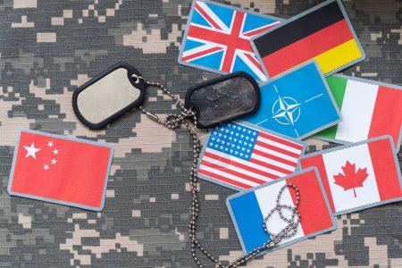 Photo for US flag patch with dog tag on multicam camouflage uniform. High quality photo - Royalty Free Image