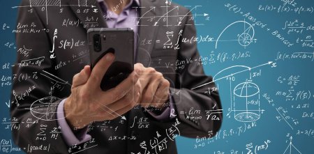 Photo for Mathematicians concept. Handsome man thinking on blue background, graphic image idea, man mathematicians are calculating with technology smartphone in a financial company - Royalty Free Image