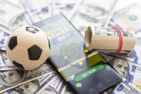 Photo for Watch a live sports event on your mobile device. Betting on football matches. High quality photo - Royalty Free Image